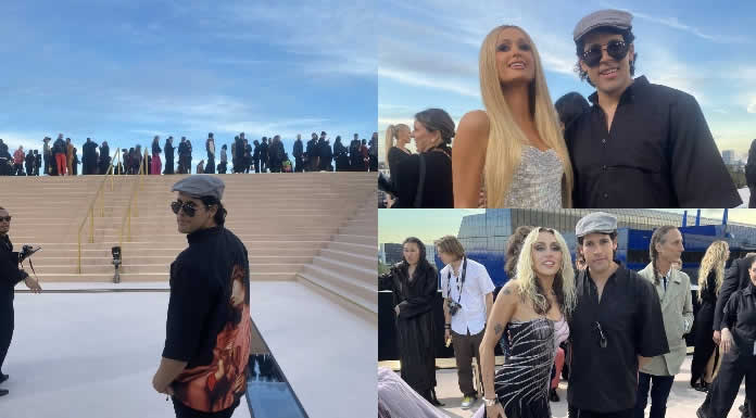 El artista mexicano Leandro Aceves rodeado de celebridades en el desfile de Versace